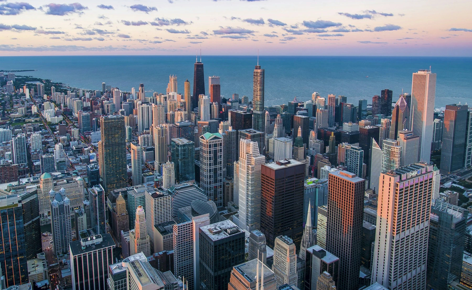 Chicago skyline beside Lake Michigan at dusk